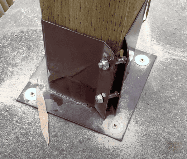 Steel brackets for holding pergola timbers to solid surfaces