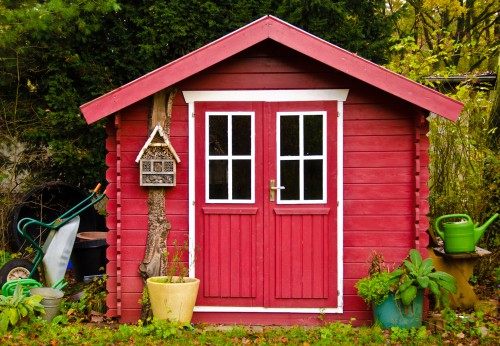 Shed painted bright red to protect from the weather and make it look good