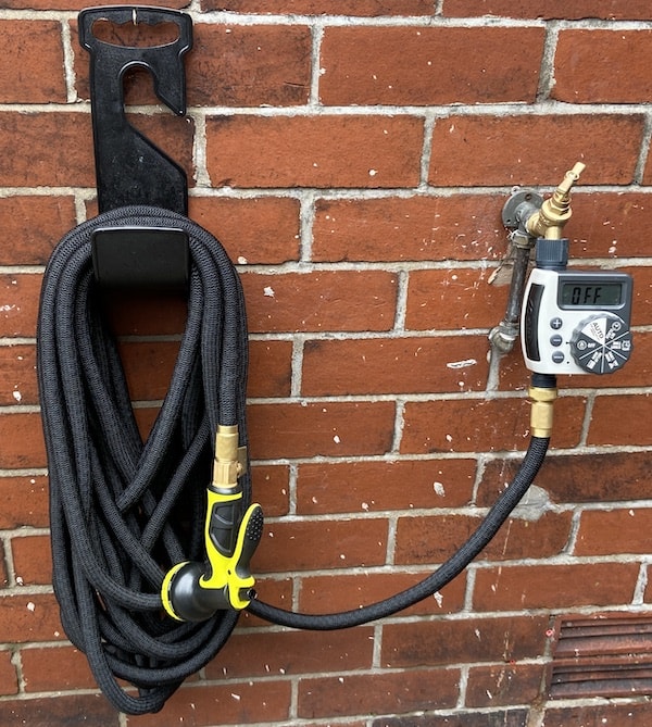 HmiL-U Garden Hose hose fixed to the wall after testing