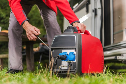 Firing Up Gas Powered Portable Inverter Generator To Connect Electricity To His Camper Van