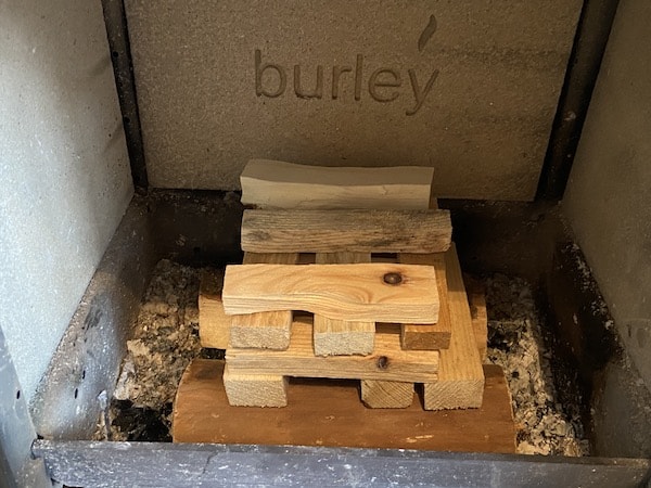 Stack your kindling as shown above. Lay them in layers but spaced and then layer the next layer in the opposite direction and in the layer in the opposite direction again with the third layer.