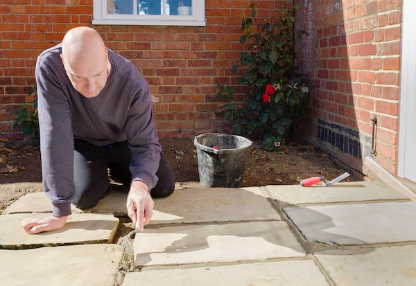 Using patio grout that you mix yourself and apply with a trowel