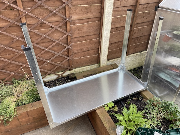 Start assembling the Palram Greenhouse Steel Work Bench by attaching the legs first and using the 8 brackets which add extra support