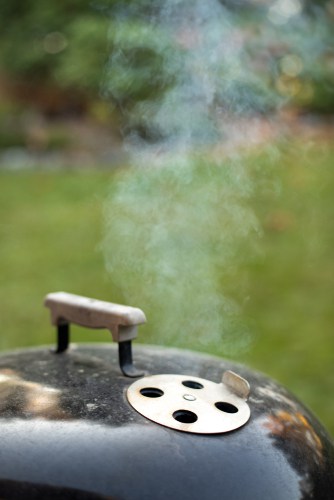 Lid of a charcoal kettle barbecue, with open air vent